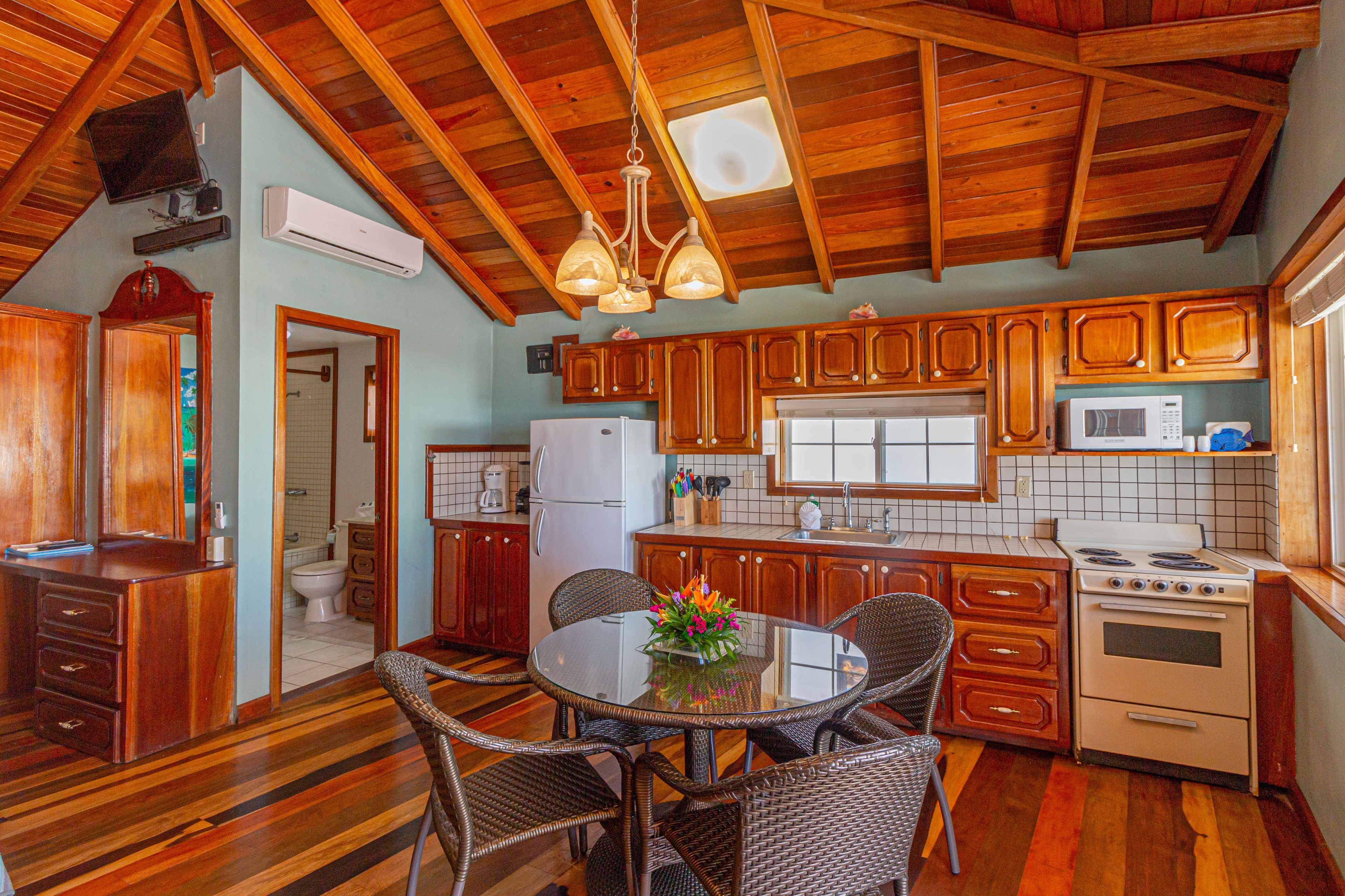 Suite with fully equipped kitchen, dining table, 4 chairs, futon, vaulted wood ceilings and wood flo