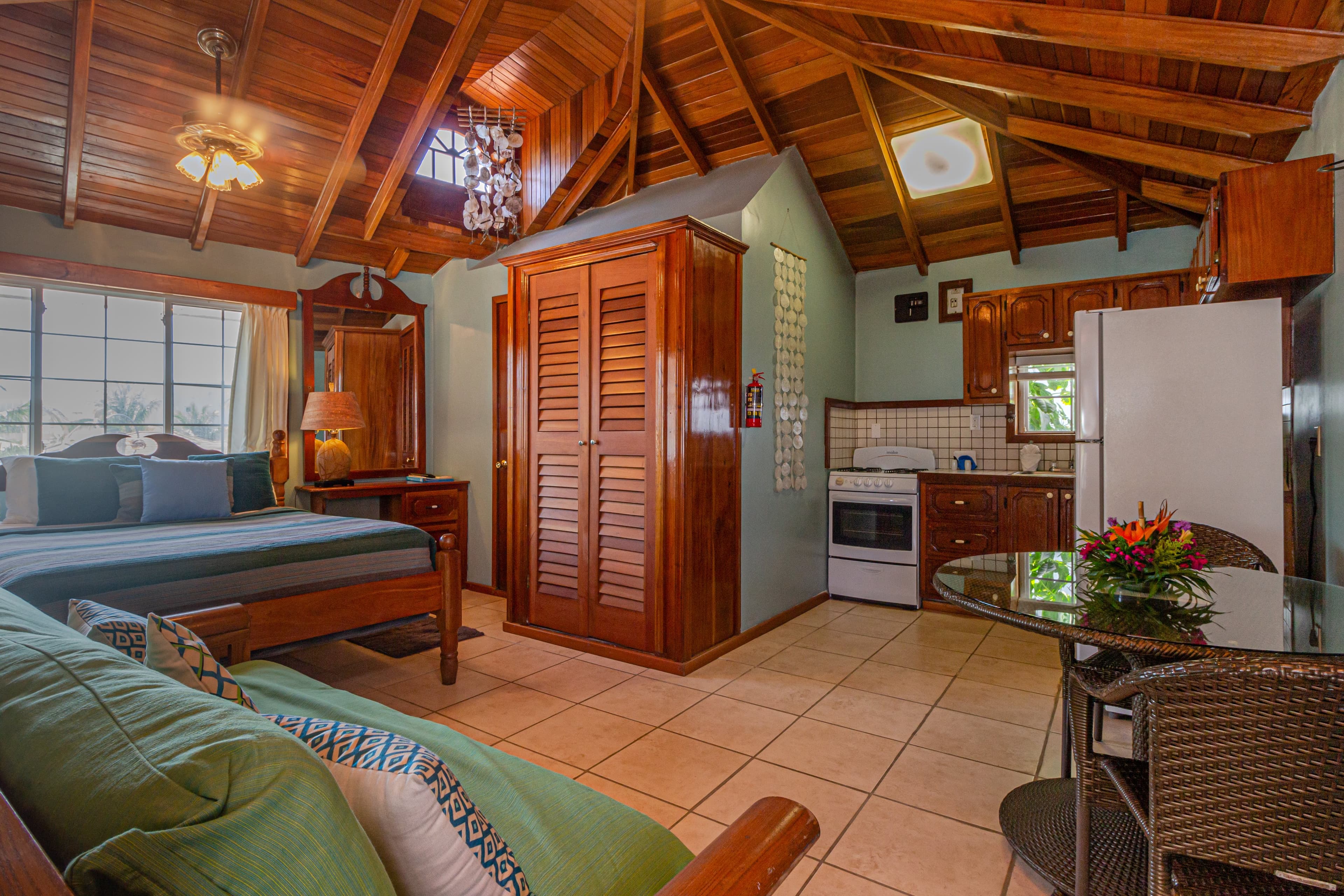 The suite has king bed, futon, vaulted ceilings, fully equipped kitchen, a/c, ceiling fans TV with C