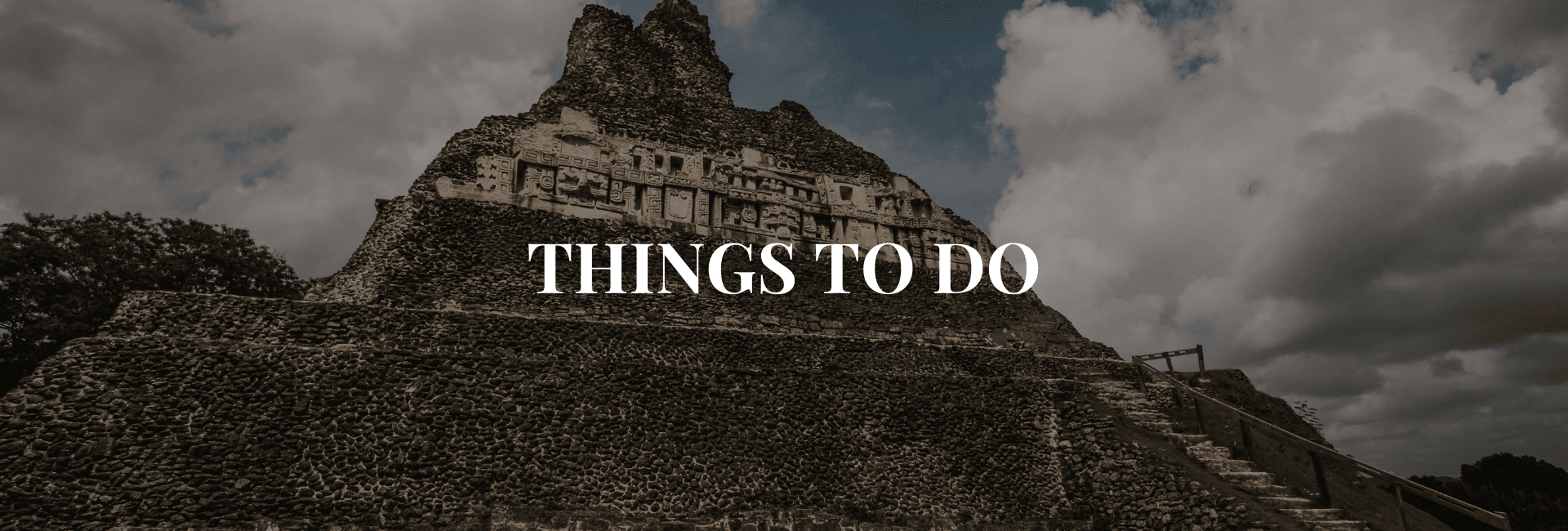 Ancient stone pyramid under a cloudy sky with text overlay saying "Things to Do."