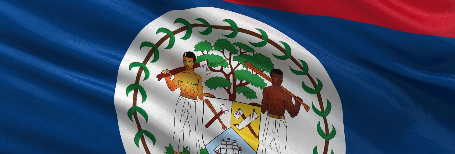 Belizean flag featuring a blue background and a coat of arms with two men holding tools and a tree in the center.