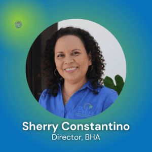 Headshot of Sherry Constantino, Director of BHA, smiling against a colorful background.