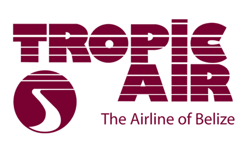 Logo of Tropic Air, the airline of Belize, featuring stylized text and a circular emblem.