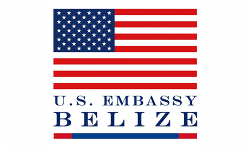 Logo of the U.S. Embassy in Belize featuring the American flag and the text "U.S. EMBASSY BELIZE."